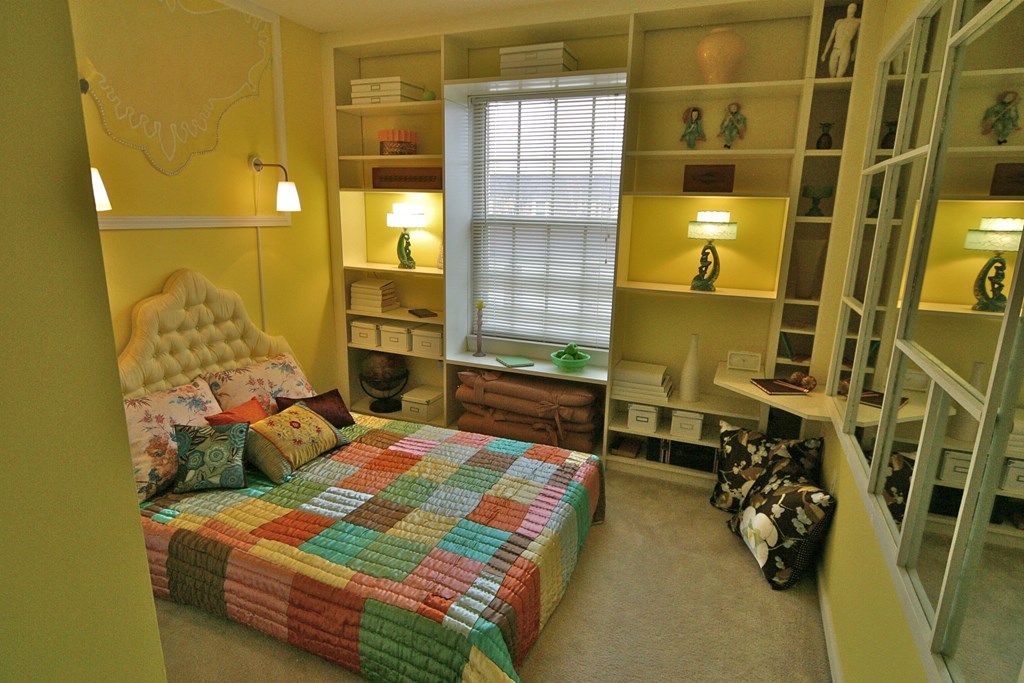 a bedroom with a bed in a closet