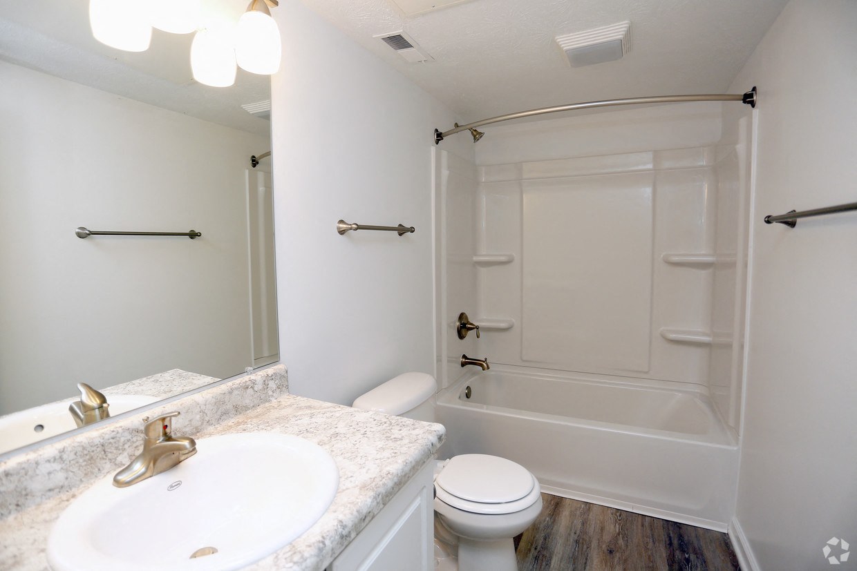 a bathroom with a sink toilet and a shower