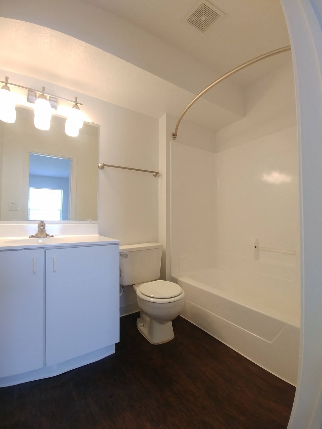 a bathroom with a toilet and a sink and a bath tub