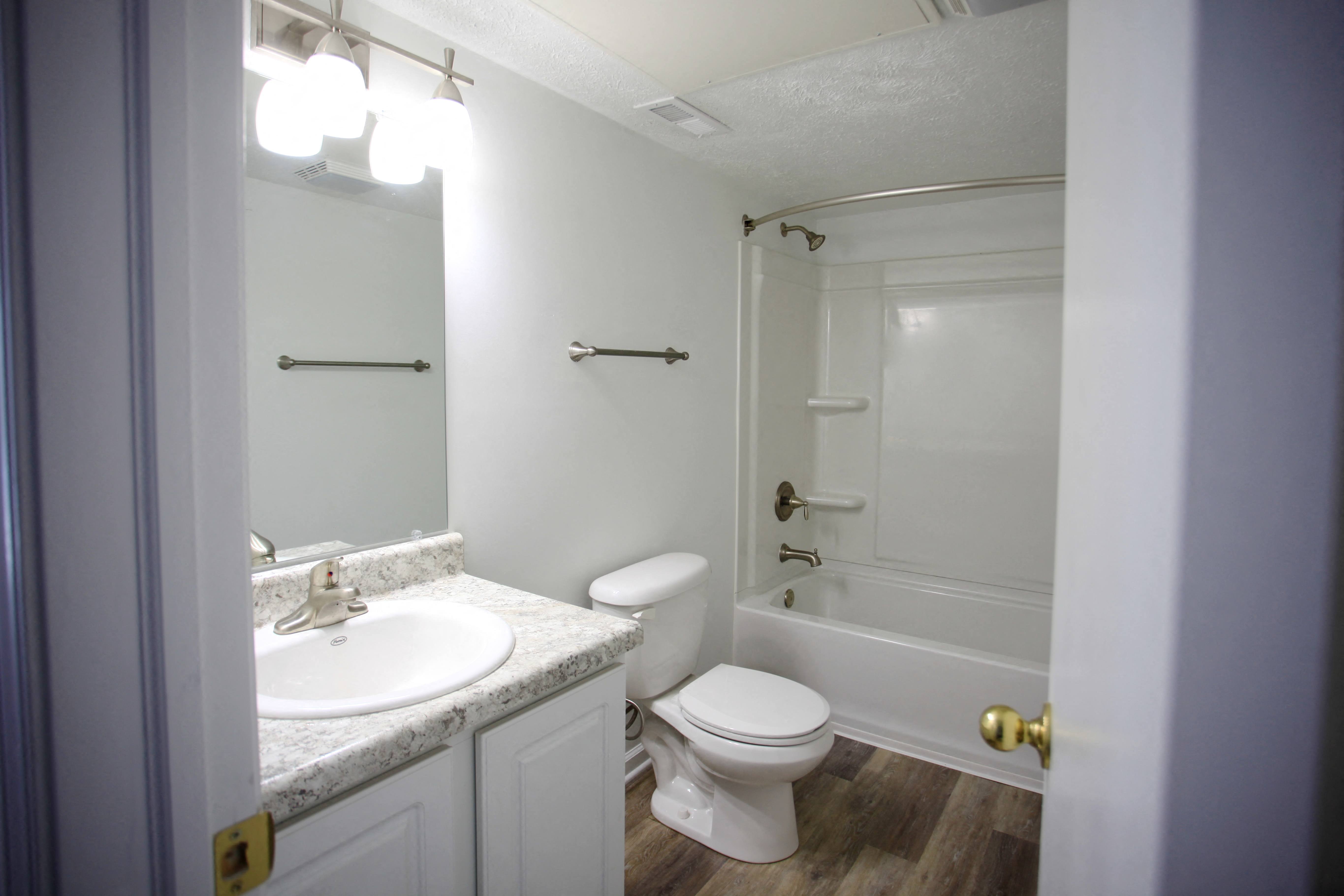 a bathroom with a sink toilet and a shower