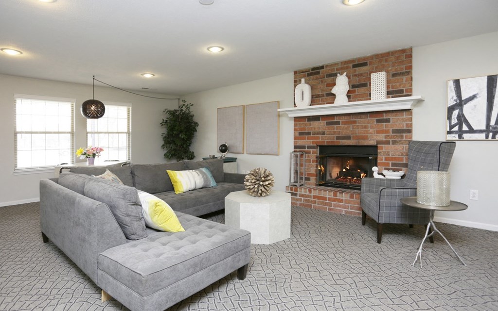 a living room with a couch and a fireplace