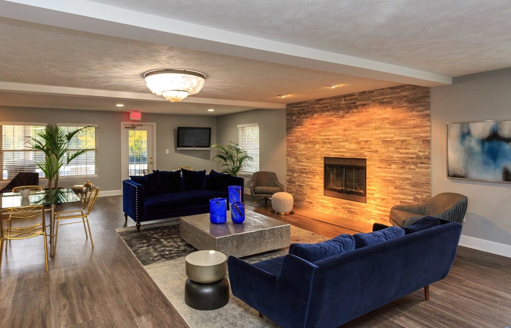 a living room with couches and a fireplace