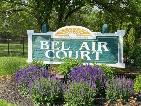 the sign in front of flowers