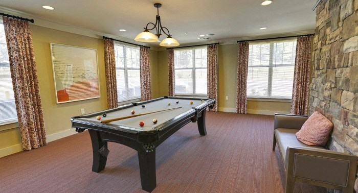 decatur affordable family apartment a game room with a pool table and a stone wall