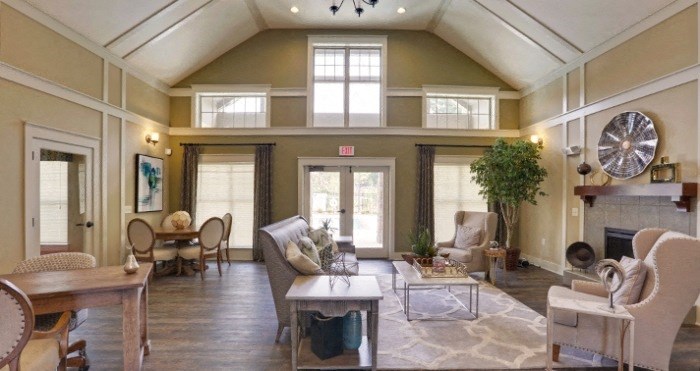 decatur affordable family apartment a living room with a vaulted ceiling and a fireplace