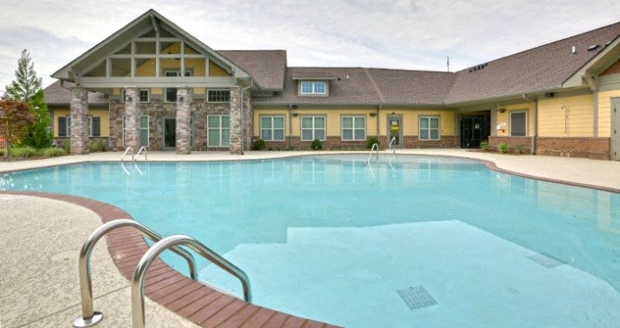 decatur affordable family apartment a swimming pool with a building in the background