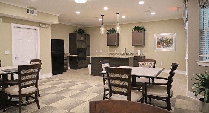 a kitchen and dining room with a table and chairs