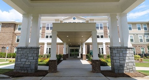 a view of the entrance to a building with pillars
