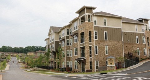 an apartment building on the corner of a street
