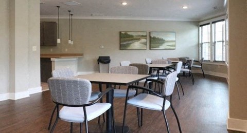 a dining room with tables and chairs