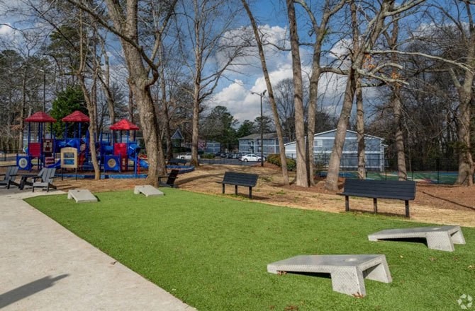 a park with a playground and benches