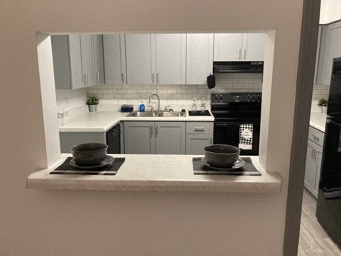 a kitchen with a counter with two bowls on it