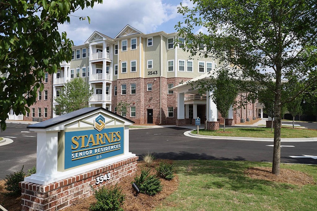 an apartment building with a sign that says stars senior residences