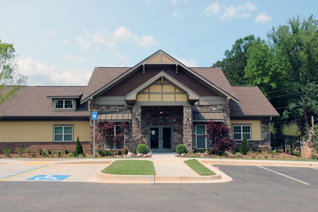 decatur affordable family apartment the front of a house with a driveway and a lawn