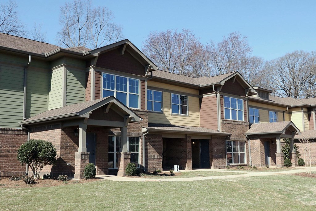 decatur affordable family apartment a large brick house with a yard in front of it