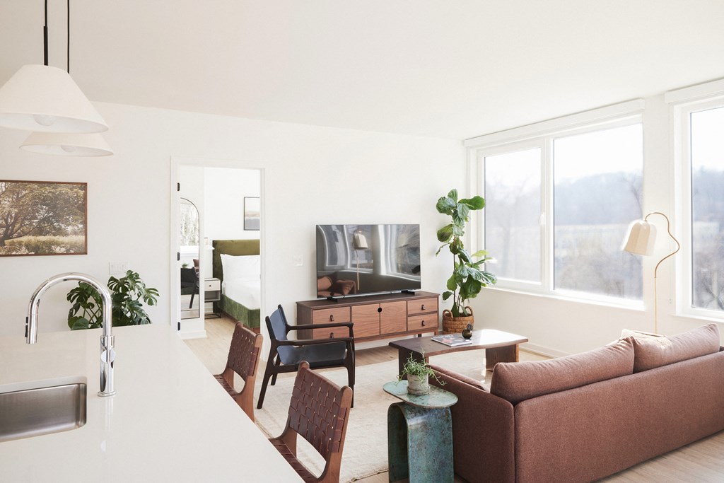 a living room with a couch and a table and a television