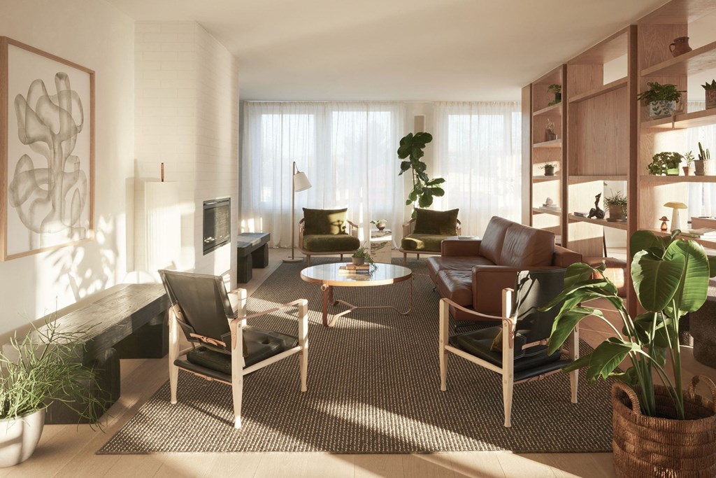 a living room with a couch chairs and a table