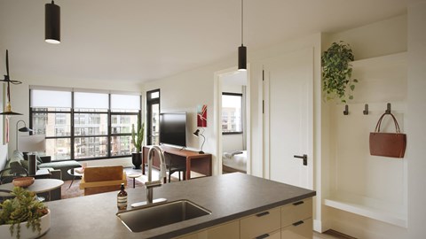 A kitchen with a sink and a window.