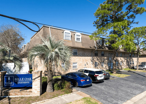 Belle Oak Apartments is a residential complex with a parking lot.