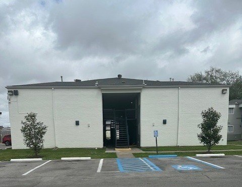 Building entrance with accessible parking spaces at Boulevard Homes Apartments, Louisiana