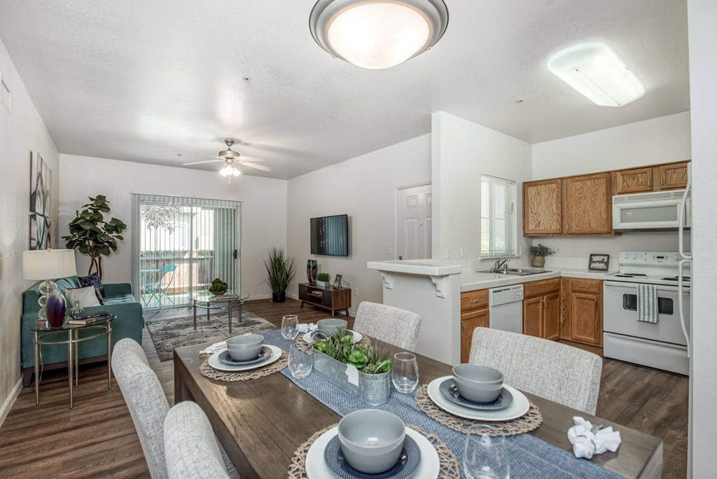 Kitchen Dinning and Living Area open to each other with wood plank floors