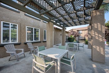 Pool Area Pergola area of the pool with table and chairs - Photo Gallery 5