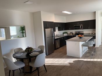 Kitchen and dining area at Villa Annette Apartments, Moreno Valley, California