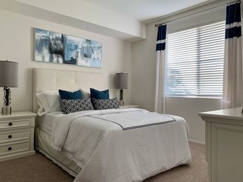 Bedroom with a large bed at Villa Annette Apartments, Moreno Valley, California
