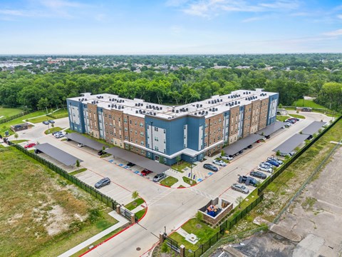 A large building with a parking lot in front of it.