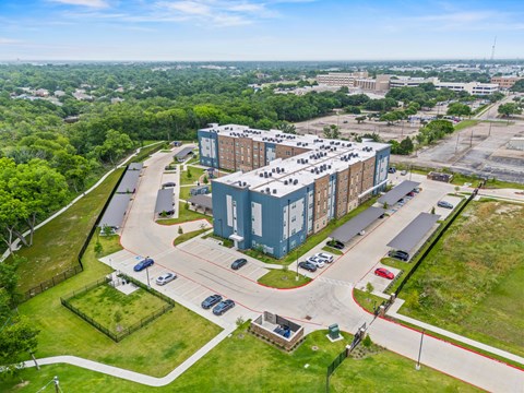 A large building with a parking lot in front of it.