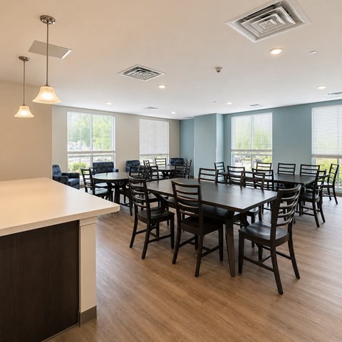 A large conference room with a long table and chairs.