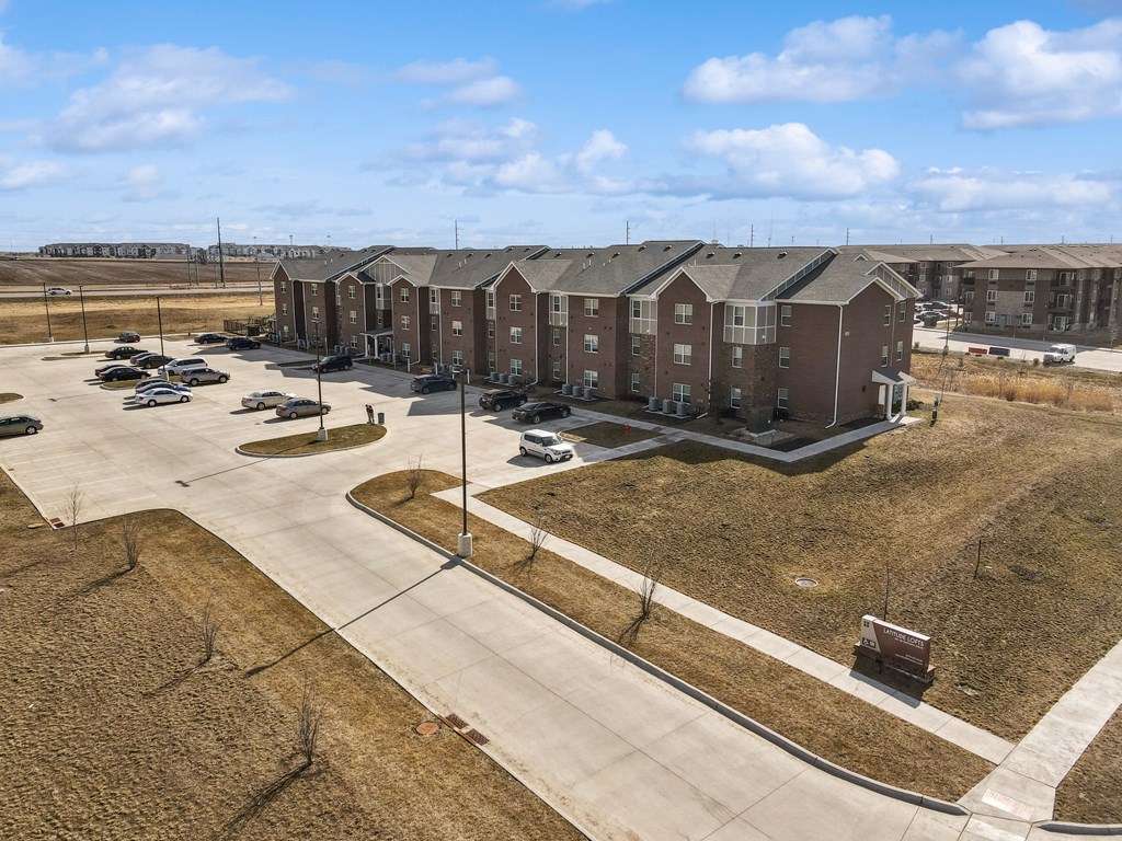 A large apartment complex with multiple buildings and parking lots.