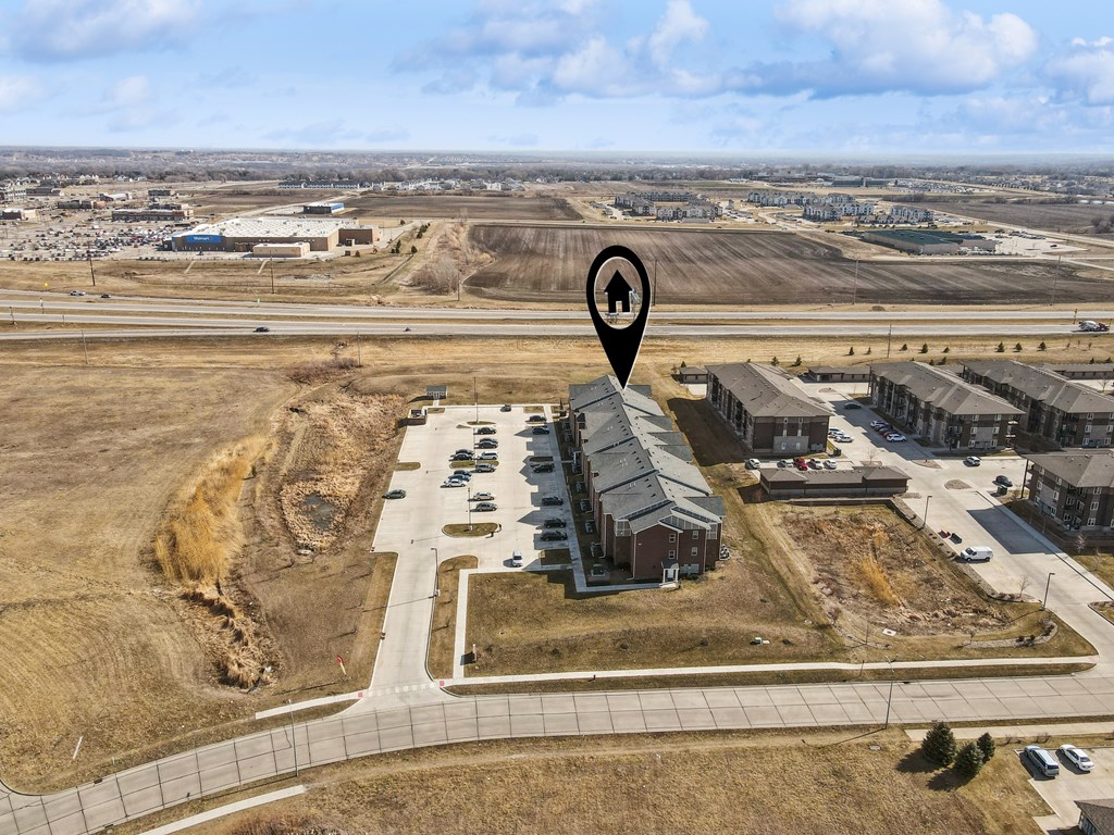 A map pin with a house icon is placed over a residential area.
