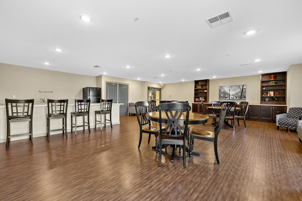 A large room with wooden floors and furniture.