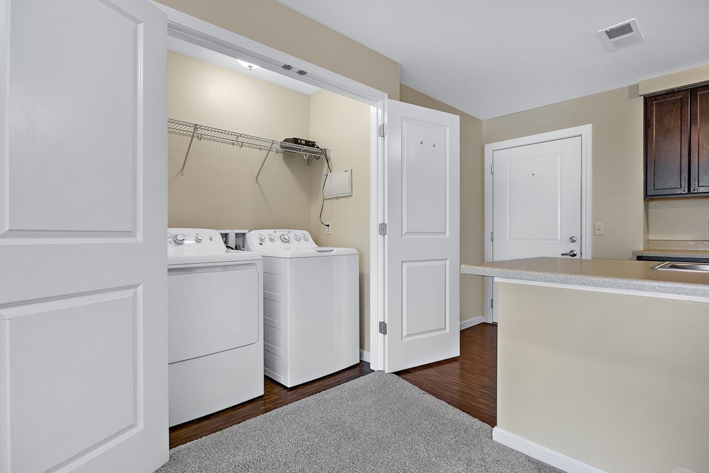 A laundry room with a washer and dryer.