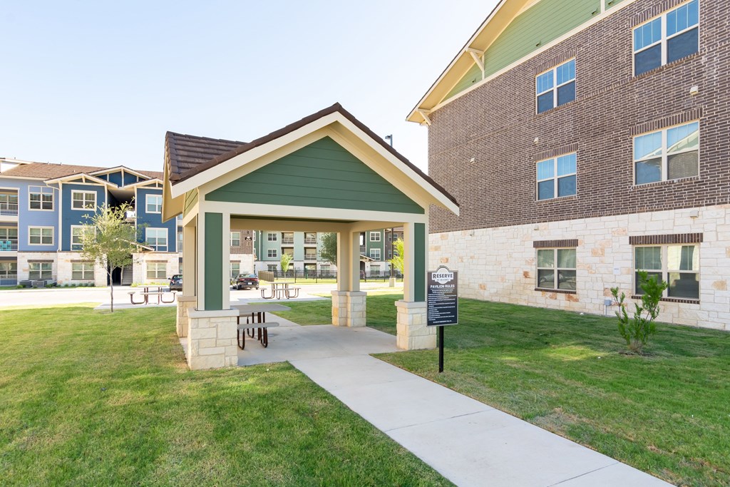 the residences at city center apartments building entrance and grass