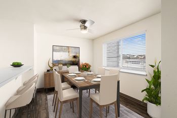a dining room with a wooden table and chairs and a window at Clearwater, Post Falls, ID 83854