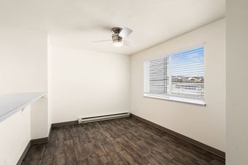 an empty living room with wood floors and a window at Clearwater, Post Falls Idaho