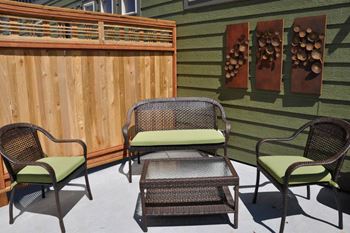a patio with chairs and a table on a patio at Copper Pines, Montana
