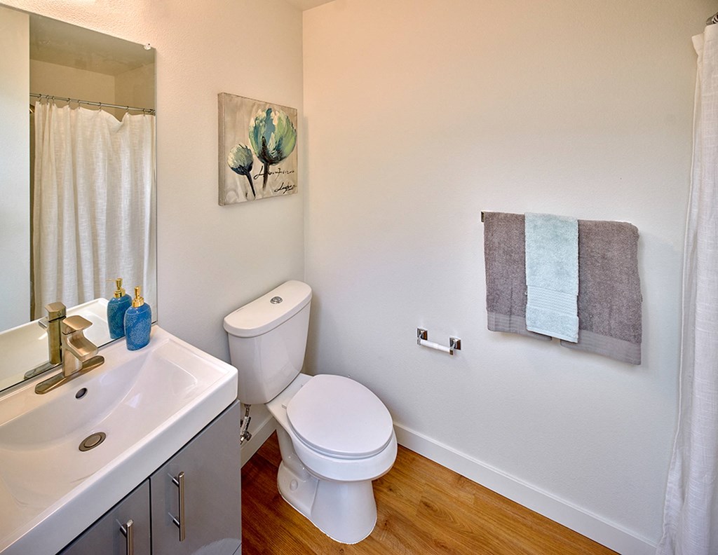 a bathroom with a toilet and a sink at Enve, Seattle Washington