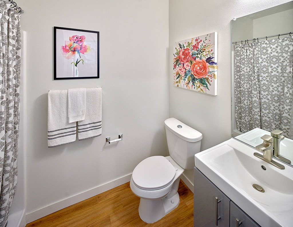 a bathroom with a toilet and a sink and a shower at Enve, Seattle, 98102