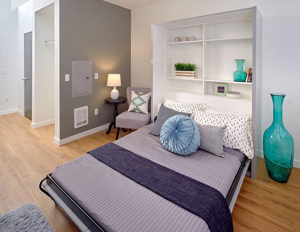 a bedroom with a bed and a blue vase at Enve, Washington, 98102