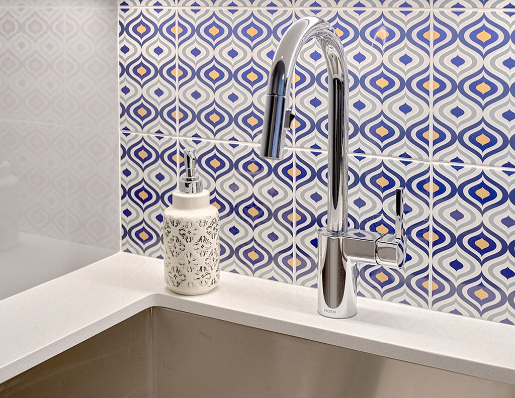 a close up of a sink with a bottle of soap on it at Enve, Washington