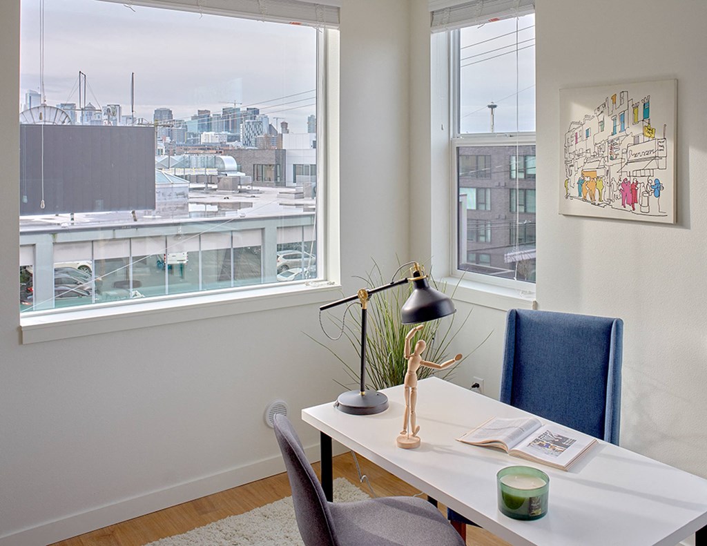 an office with a desk and a window with a view of the city at Enve, Seattle, WA