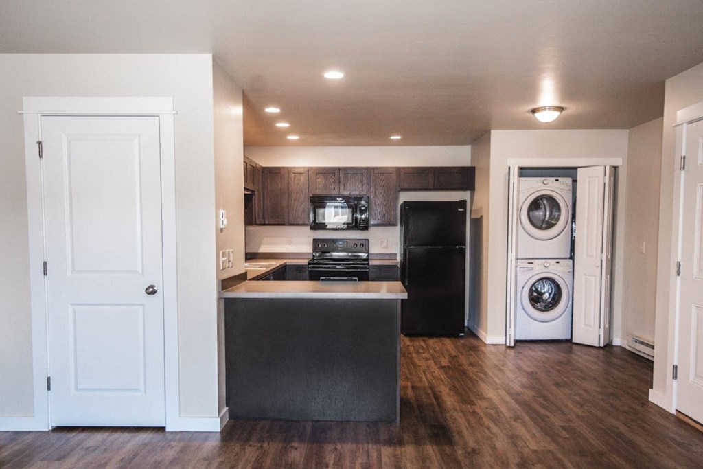 a kitchen with a washer and a dryer in it at Madison Park, Montana, 59718