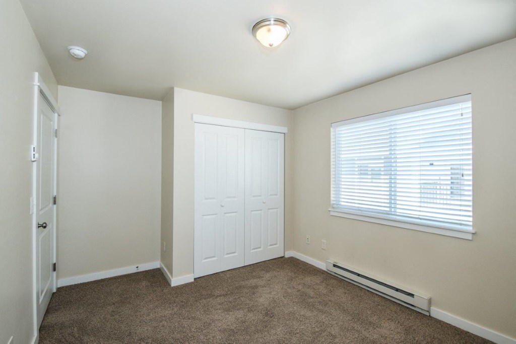a room with carpet and a window and a door at Madison Park, Bozeman, MT, 59718