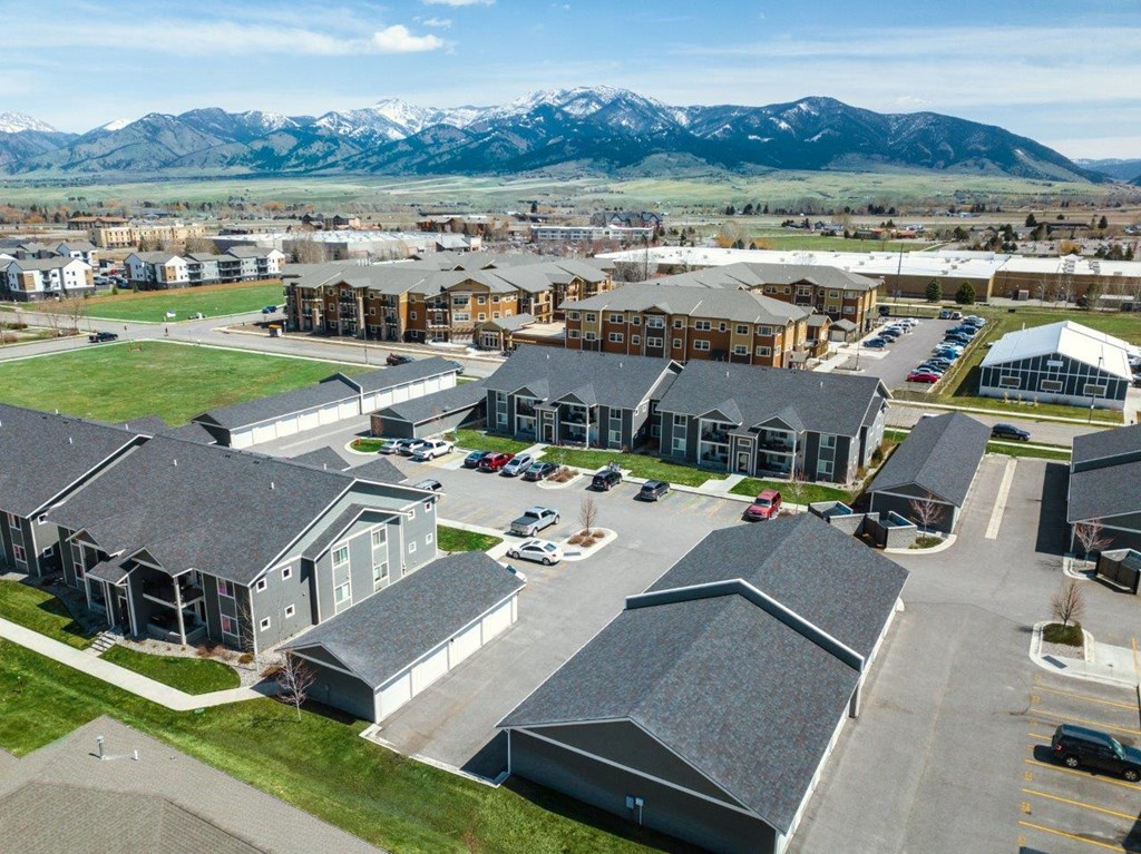 a city with mountains in the background at Madison Park, Bozeman, 59718