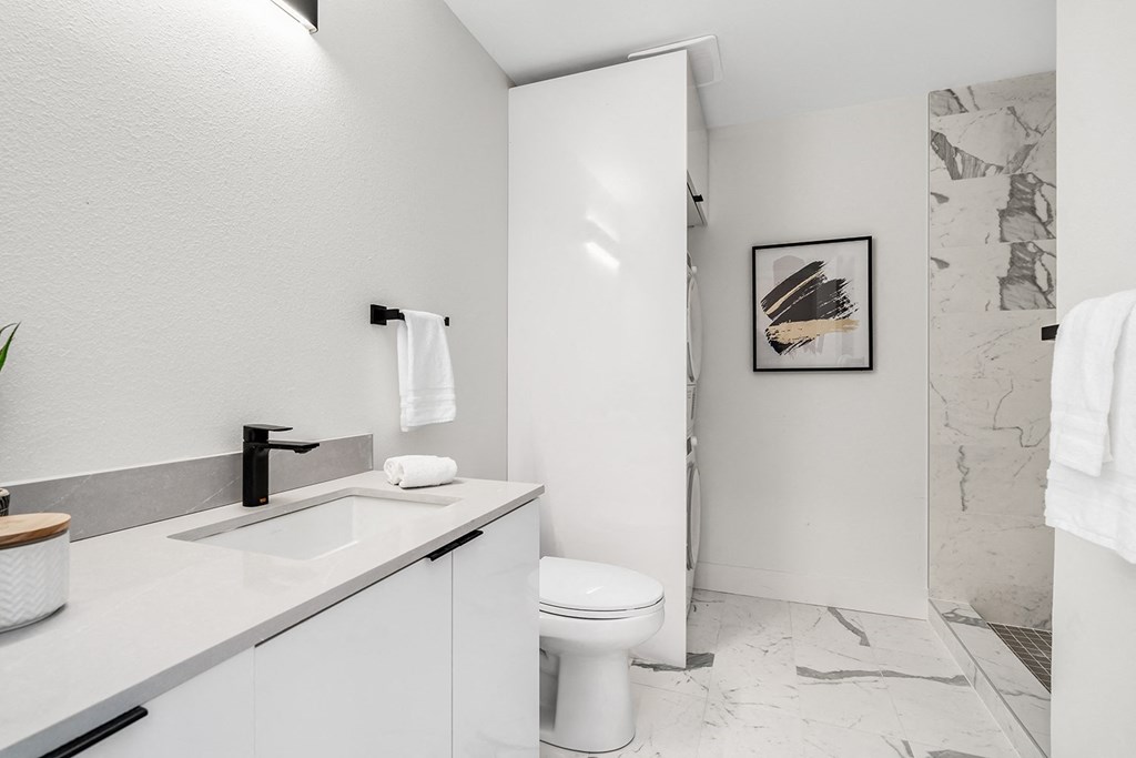a bathroom with a sink and a toilet and a shower  at Oslo, Washington