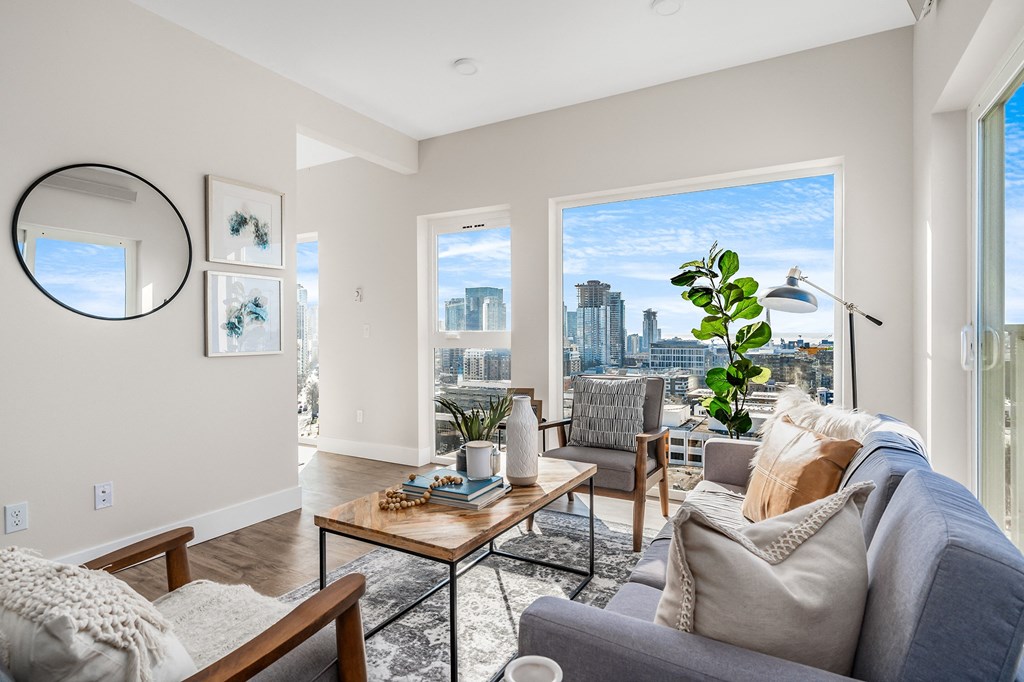 an open living room with a view of the city  at Oslo, Seattle, WA