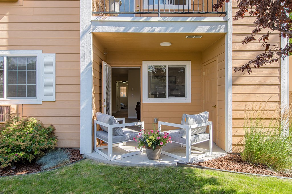 two rocking chairs on a porch of a home  at Quail Springs, West Richland, Washington